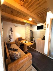 a living room with a couch and a table at Bungalows Ivan in Žabljak