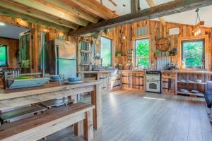 a large kitchen with wooden walls and wooden floors at 1 Bed in Bream oc-m43316 in Bream +17 photos