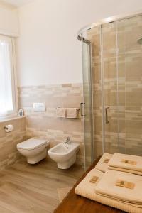 a bathroom with a shower and a toilet and a sink at borgo nel vigneto 2 in Erbusco +8 photos