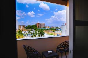 a view of a city from a window at Hotel RAAGA INN in Tirupati