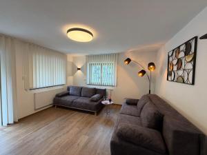 a living room with a couch and a table at Mountain hOMES in Axams