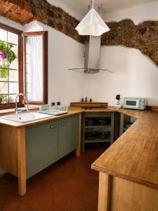 a kitchen with a sink and a counter top at Residenza Vittoria nell'Antico Borgo in Piombino