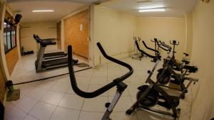 a gym with several exercise bikes in a room at Acrópolis Marina Hotel in Angra dos Reis