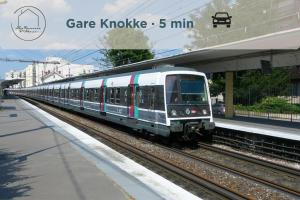 a train on the tracks at a train station at Villa Duinbergen - Séjour Familial à Knokke-Heist in Knokke-Heist