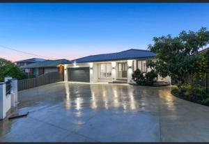 a house with a driveway in front of it at Seffa 5 vella property in Springvale South