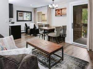 a living room with a table and a dining room at Vail 21 Condo 502 in Vail