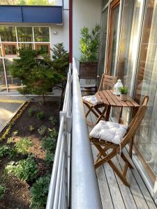 a balcony with a table and chairs on a house at SeaSand in Jūrmala