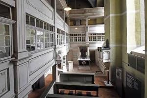 a large room with a kitchen with a stove at Cosy Studio flat in the centre of Colditz in Colditz