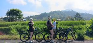 a group of people standing next to their bikes at Green Labak 1 in Silebeng