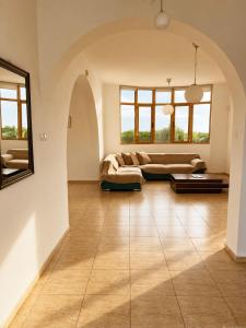 a large living room with a couch and a table at Mariandy Villa 2 in Coral Bay