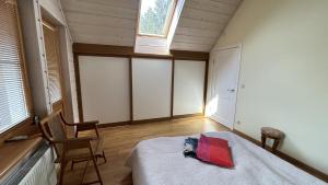 a bedroom with a bed and a window at Melluzi Seaside Residence in Jūrmala