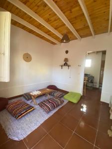 a living room with a couch in the middle of a room at Bedro Private Garden Studio & Outdoor Lounge 1 Min to Sea in Dahab