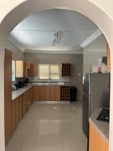 an archway in a kitchen with a stainless steel refrigerator at Sunrise Villa Self Catering and Accommodation in Lüderitz