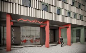 a man standing in front of a building at Moov Hotel Matosinhos Sul in Matosinhos
