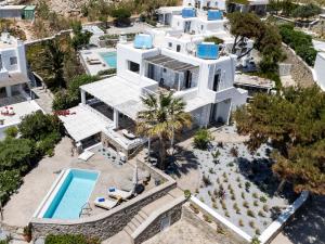 an aerial view of a white house with a swimming pool at myMykonos villa II in Platis Gialos