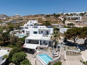 an aerial view of a white house with a swimming pool at myMykonos villa II in Platis Gialos