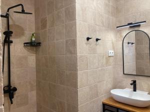 a bathroom with a sink and a mirror at NOV Lernatun Boutique Hotel in Ltsen +89 photos