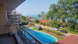 a view of a swimming pool from a balcony at Beach View Apartment Chernomorec in Chernomorets
