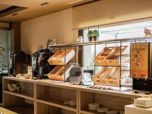 a bakery with a counter with boxes on it at Ibis Styles Figueres Ronda in Figueres