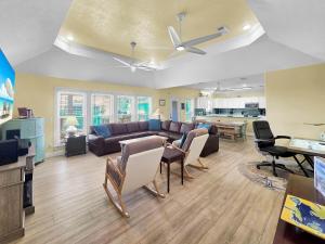 a living room with a couch and chairs at Pelicans and Palms home in Crystal Beach
