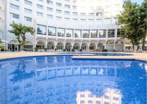 a large swimming pool in front of a building at Kenzi Solazur in Tangier