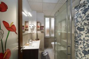 a bathroom with a sink and a shower at Hotel Priscilla in Rome +38 photos