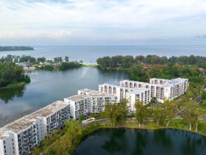an aerial view of apartment buildings on the water at Cassia Residence by Metrika, Laguna Phuket in Laguna Phuket