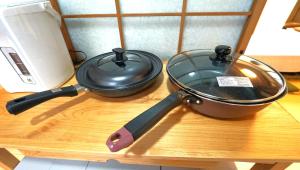 a pot and a pan on top of a table at YADOOR名張 -kominka- in Nabari +16 photos