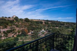 a view from the balcony of a house on a hill at B&B Le Buche Casa Storica in Canino +12 photos