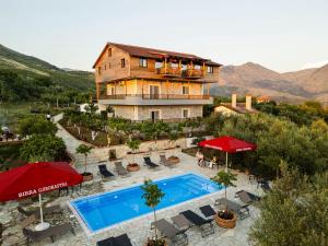 an aerial view of a villa with a swimming pool at Shena The Farm Boutique in Mesopotam