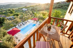a view from the balcony of a villa with a swimming pool at Shena The Farm Boutique in Mesopotam