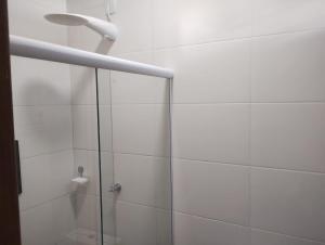 a shower with a glass door in a bathroom at Hotel In Box - Salvador - Posto HG in Salvador