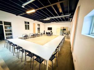 a large conference room with a long table and chairs at Nordic Lodges in Malmö