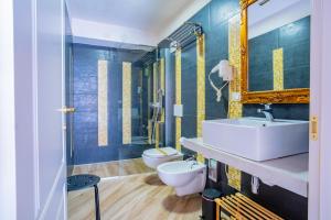 a bathroom with two toilets and a sink at Salento Ada's House in Melendugno +121 photos