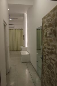 a hallway with a wooden door in a room at Heaven By O in Unawatuna +26 photos
