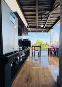 a kitchen with a large counter with a table and chairs at La Casa D Juan in Puerto Baquerizo Moreno +39 photos
