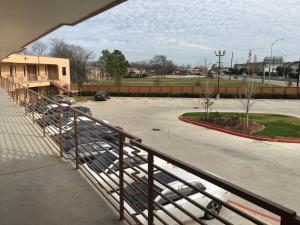 a view of a parking lot from a balcony at Crystal Inn in Houston