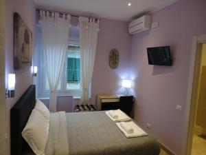 TV a/nebo společenská místnost v ubytování Guest House Le Tre Spezie