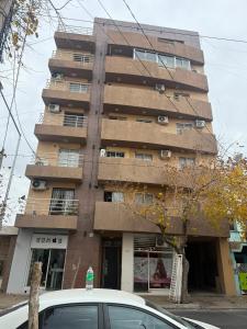 a tall building with a car parked in front of it at General Acha 869 in San Juan