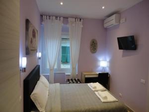 TV a/nebo společenská místnost v ubytování Guest House Le Tre Spezie