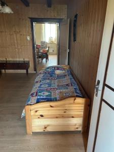 a bedroom with a wooden bed in a room at LEMAFIOlY in Cemboing