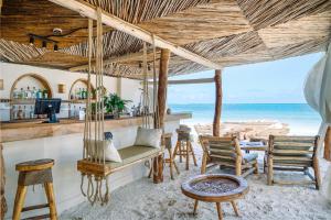 a hammock room with a view of the ocean at Mala Boutique Hotel in Bwejuu