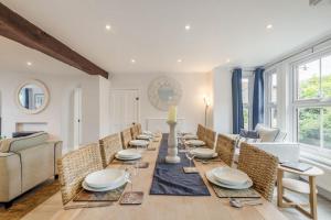 a dining room with a long table and chairs at 6 Bed in Bacton oc-2316 in Bacton