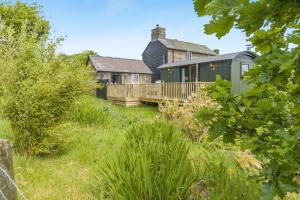 a house on a hill with a deck at 1 Bed in Knighton oc-51898 in Beguildy
