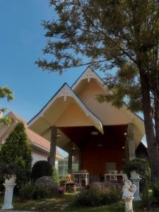 a house with a pitched roof with a tree at silverpine khao kho in Phetchabun +26 photos
