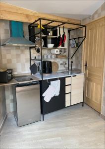 a kitchen with a sink and a stove top oven at El capricho de la Providencia in Gijón