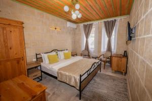 Vuode tai vuoteita majoituspaikassa IVY Cappadocia