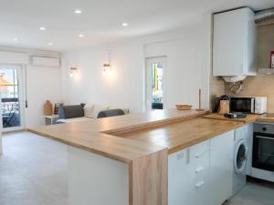 a kitchen with a wooden counter top in a room at Old Town Spot Apartment by Stay ici in Albufeira