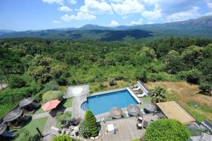 an aerial view of a house with a swimming pool at A Fontana in Zonza