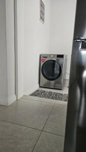 a microwave sitting in the corner of a room at Nou Lakaz in Rose Hill